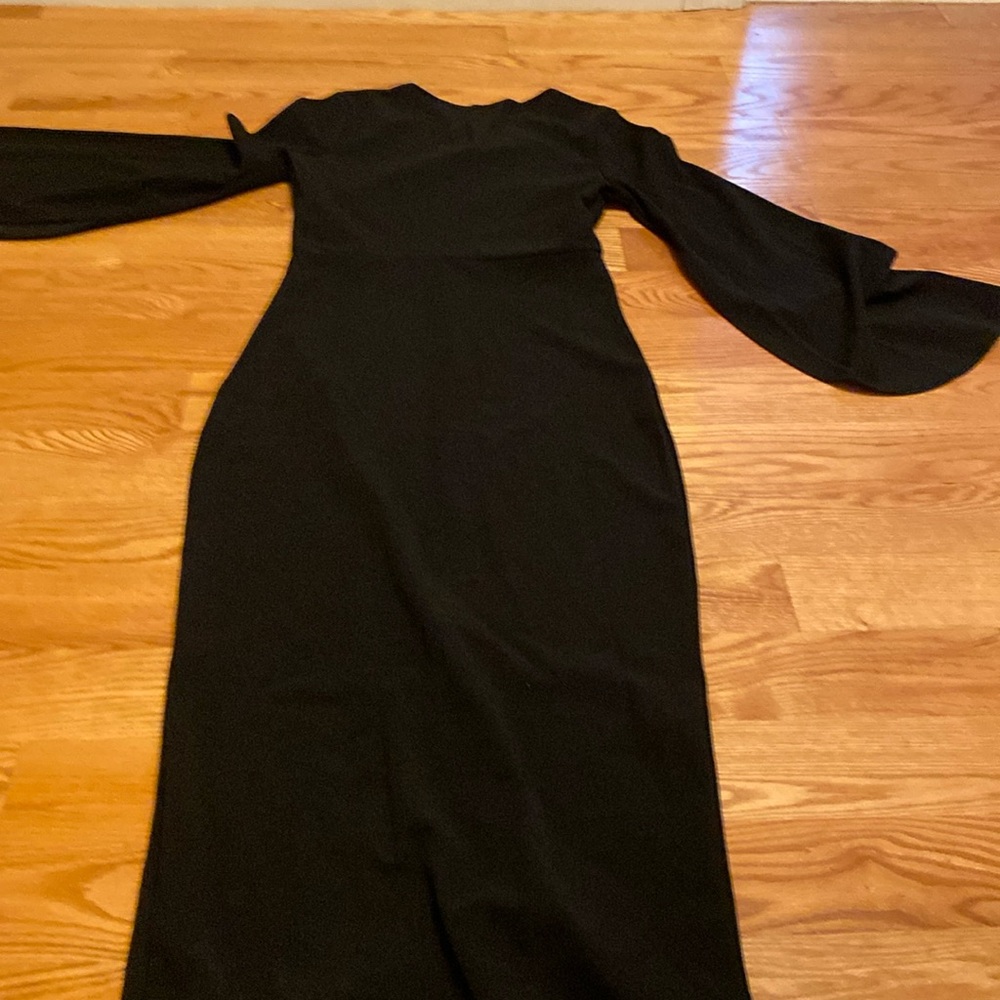 Classic black dress with bell sleeve nwot size M but runs snug